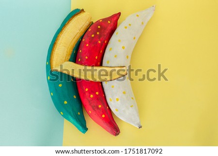 blue banana peel with banana pieces on a blue flat background