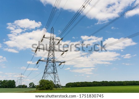 Electricity pylons in a field with blue sky. Much Hadham. Hertfordshire. UK
 Royalty-Free Stock Photo #1751830745