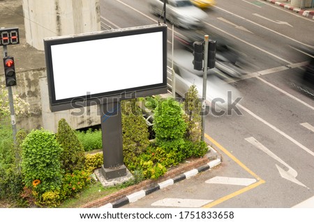 Blank advertisement billboard, mock up, information board with traffic lights  on the street. Advertising concept