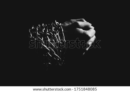 Hands in chains and in the dark