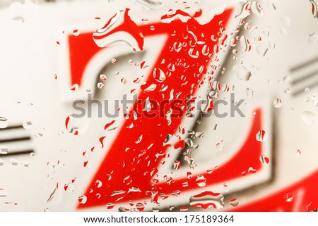 color abstract background with water drops on glass with character Z in background 