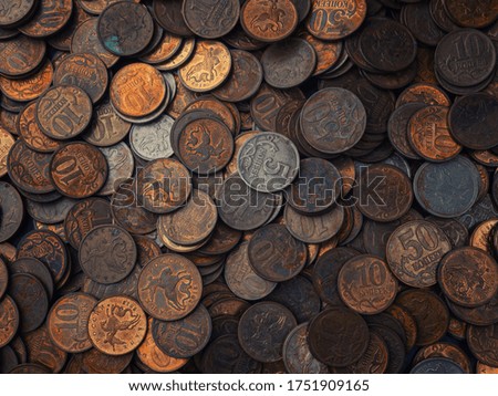 Background of old coins in low key. Old Russian coins, rubles and pennies.