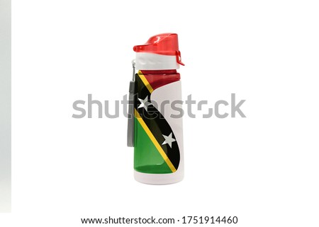 Sports Water Bottle with Saint Kitts and Nevis flag on the bottle and isolated on a white background. Healthy lifestyle concept.