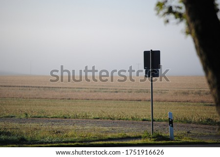 traffic sign in morning sun with fog