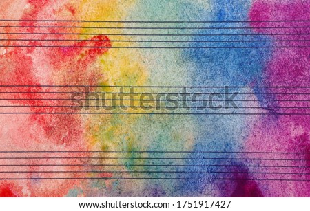 Colors of rainbow. Melody concept. Old music sheet in colorful watercolor paint. Music concept. Abstract colorful watercolor background.