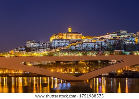 historic Coimbra cityscape with university at top of the hill in the evening, Portugal Royalty-Free Stock Photo #1751988575
