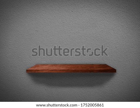 Hardwood shelves on concrete wall texture in minimal Style  background with clipping path for design 