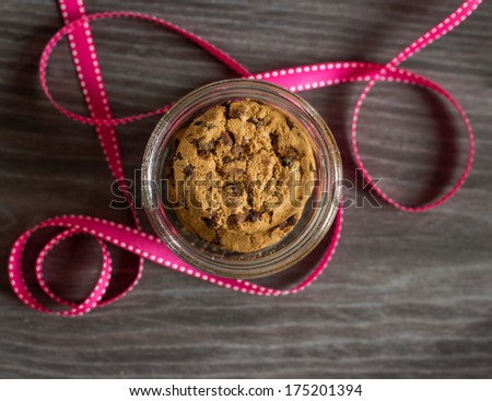 Chocolate chip cookies in a glass jar, celebration concept