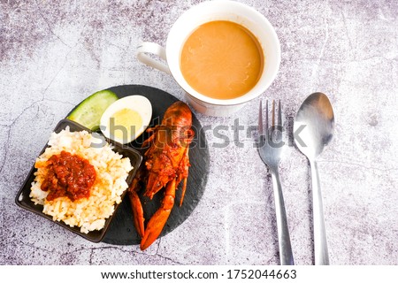 A flatlay picture set of "nasi lemak" lobster with coffee.