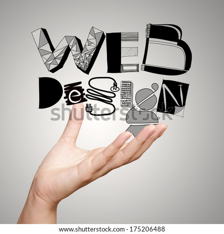 clouse up of  hand showing design word WEB DESIGN  as concept