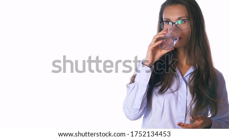 Cheerful mid-age hispanic latin woman hold a water glass. Isolated studio portrait on white. Healthy eating lifestyle and weight loss concept.