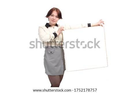 young office business woman in a ripe blouse with short hair. holds the test space in his hands