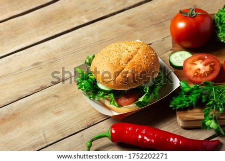 Vegetables on a cutting board on a wooden background. Products for cooking
