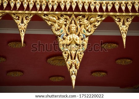 A picture of an angel guarding Buddhism in a Thai temple
