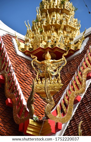 A picture of an angel guarding Buddhism in a Thai temple