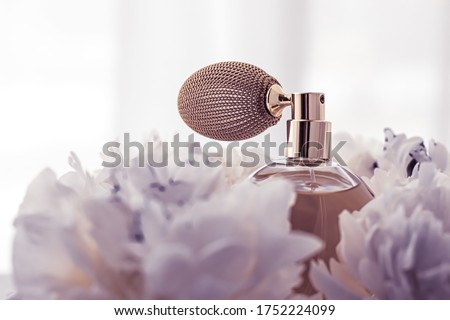 Luxe fragrance bottle as vintage perfume product on violet background and peony flowers, parfum ad and beauty branding design Royalty-Free Stock Photo #1752224099