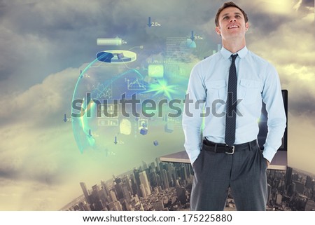 Smiling businessman standing with hand in pocket against global technology background