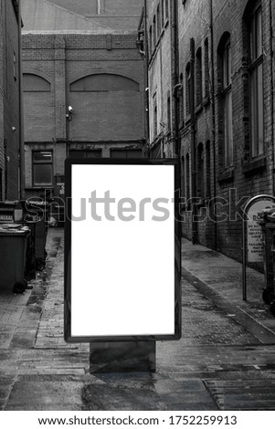 Blank advertising mockup in the street . Poster billboard on city dirty alley background