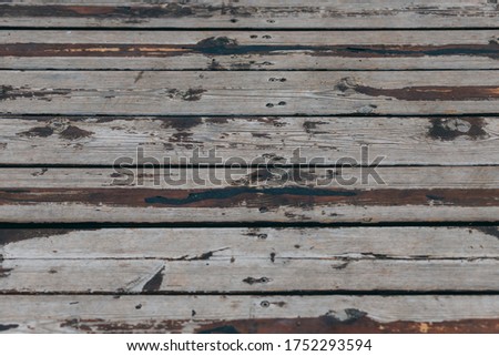 Close-up view of gray and brown wooden fence panels. Wood Pattern Background Texture. Old gray wooden wall, background photo. Plank weathered wooden background. Brown wood texture from natural tree