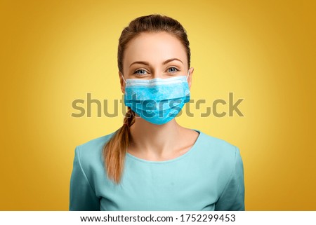 The protective mask on the girl is correctly put on. A nurse at work. A woman in self-isolation. Quarantine and virus. Protection for coronavirus in the hospital and at home. A masked doctor. Royalty-Free Stock Photo #1752299453