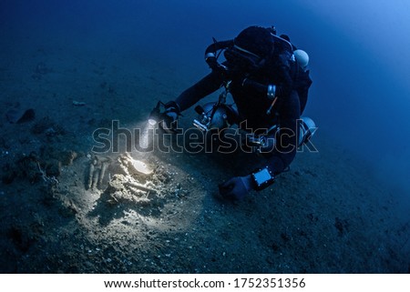 Tech diver exploring under the water