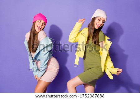 Portrait of nice attractive lovely pretty cheerful cheery girls dancing chill out having fun weekend amusement hen isolated over bright vivid shine vibrant violet lilac purple color background