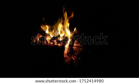 Photo of wood that is burning.