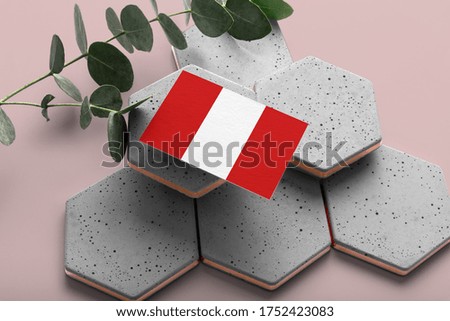 Peru flag on hexagon stylish stones. Pink copy space background. Flat lay, top view minimal national concept.