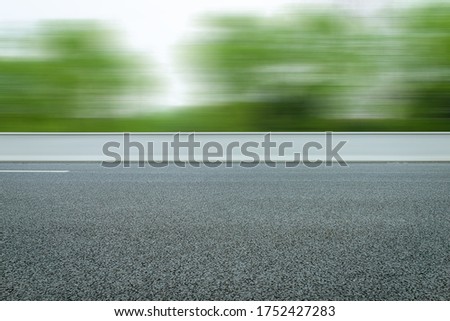 Highway with frontal blurry asphalt road