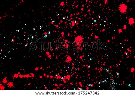 Bright paint splat design with a black background