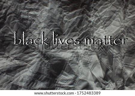 The phrase Black Lives Matter written on a background of crumpled paper. Black Lives Matter. I can't breathe Statement. Black citizens are fighting for equality. The social problems of racism.
