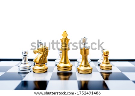 The battle chess sport game stand on chess board with dark background.Business leader concept for market target strategy.Intelligence challenge and business competition success play.Symbol of winner.