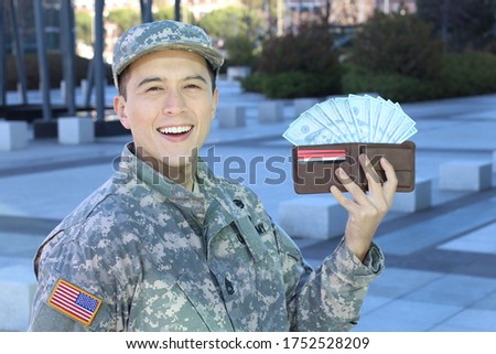 Military man getting extra income  Royalty-Free Stock Photo #1752528209