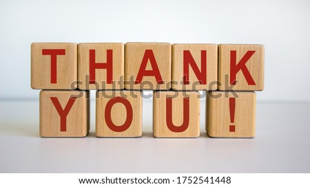 Wooden cubes with the inscription 'thank you'. Beautiful white background, copy space.