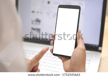 Close up image of smart phone mockup, businesswoman holding phone with white screen template