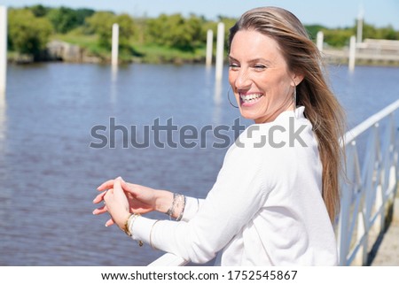 beautiful woman sea side portrait of cheerful smiling girl with blond hairs