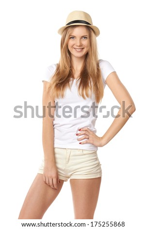 Natural smiling teen girl posing in blank white tshirt and straw hat