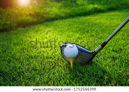 Golf balls on the golf course with golf clubs ready for golf in the first short. In the morning, with the beautiful sunlight.Sports that people around the world play in the holidays. 