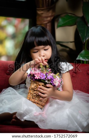 Portrait of cute asian little girl in princess dress,A girl pose for take a picture,Thailand people