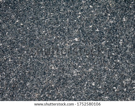 Black rough stone pattern background Texture of old building wall. Surface Close Up View, Seamless uneven stone material template design.   