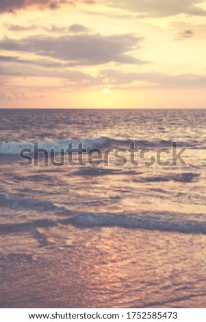 Blurred picture of ocean at sunset, summer vacation background.