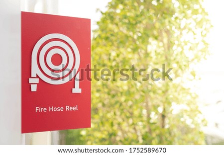 Red fire alarm sign on the white wall for safety first and sign for alert the fire being.