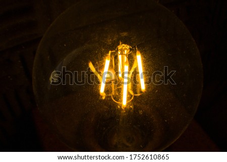 led bulb light in a black background