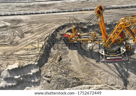 Bucket-wheel excavator for surface mining in a lignite quarry, Heavy industry.  Royalty-Free Stock Photo #1752672449