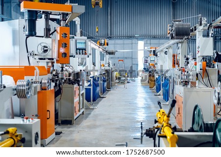Inside the new factory manufacturing electrical cable. Cable production. Royalty-Free Stock Photo #1752687500