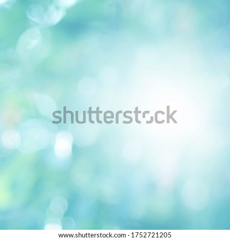 Green light leaves blurred and blur natural abstract. Effect sunlight  soft bright shiny style  bokeh circle yellow and orange blurry morning . For wallpaper backdrop and background.
