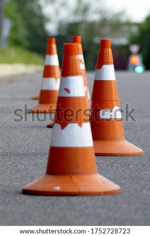 road or building cone on the roadway to restrict movement and the inability to park the car or for training athletes