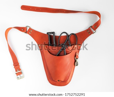 Brown leather garden holster with garden tools on a white background Royalty-Free Stock Photo #1752752291