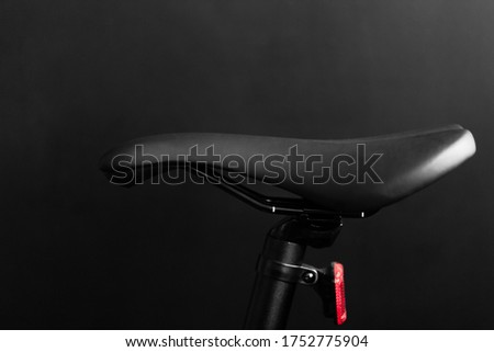 close up shot of the black bike saddle on the black background Royalty-Free Stock Photo #1752775904