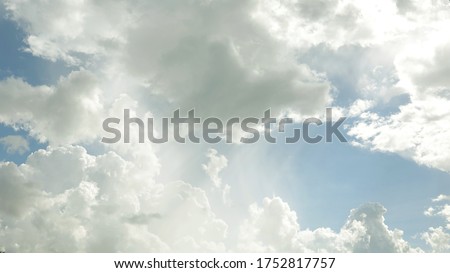 Fluffy white cloud with soft blue sky background texture